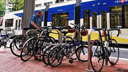 Bicycles parked at bus stop.