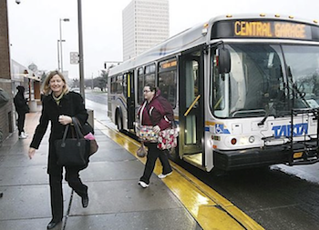 Passengers disembarking bus