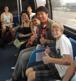 Students riding a bus with Dr. Zongzhong Tian from the University of Nevada, Reno.