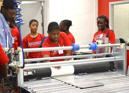 NTSI students with sign-making equipment.